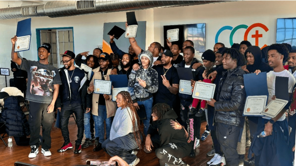 Beat the Block graduates holding certificates.